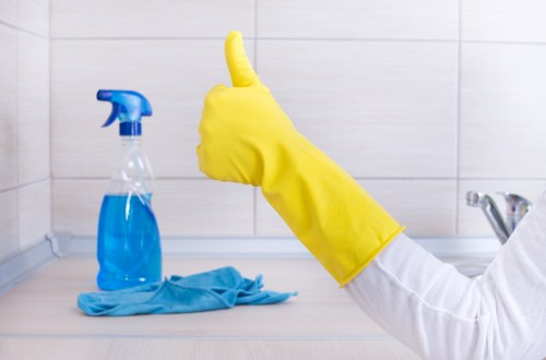 Technician cleaning a sofa with deep upholstery cleaning equipment