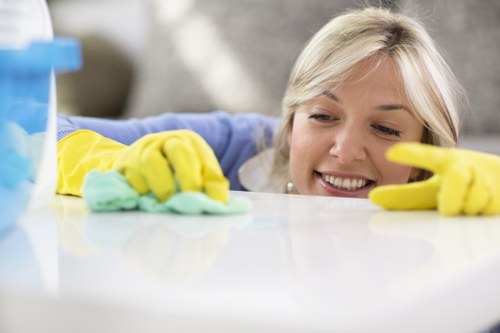 Technician using deep cleaning equipment for business carpets in Alperton